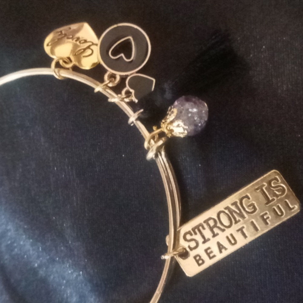 Inspirational bangles strong is beautiful tag,black tassel,gold tone. Expandable